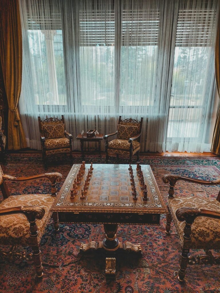 A sophisticated chess setup in a luxurious Parisian room with vintage decor.